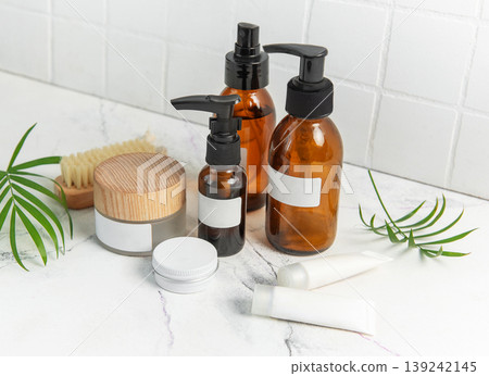 Skincare beauty products on marble with plant leaves 139242145