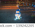 Winter illuminations and snowman sculptures create a magical scene in the park at night. 139242205