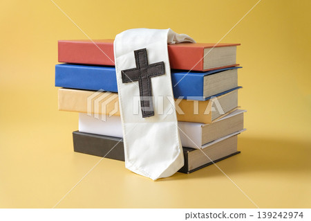 Hard cover books with cross symbol minimal concept for spirituality. Hard cover books with cross symbol minimal concept for spirituality. 139242974