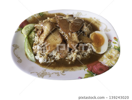 Isolated on a white background with a clipping path, this expertly prepared Khao Moo Daeng features tender slices of honey-roasted red pork and crispy belly over fluffy jasmine rice. A decadent, 139243020