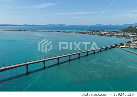 A drone aerial photograph of the bridge connecting Henza Island and Hamahiga Island in Okinawa Prefecture, and the blue sea. A drone aerial photograph of the bridge connecting Henza Island and Hamahiga Island in Okinawa Prefecture, and the blue sea. 139243120