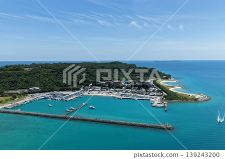 Drone aerial footage of the port scenery and blue sea at Henza South Port in Okinawa Prefecture. Drone aerial footage of the port scenery and blue sea at Henza South Port in Okinawa Prefecture. 139243200