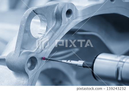 Advanced multi-axis CMM machine measuring precision dimensions of an automatic gear housing part. 139243232
