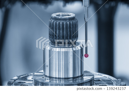 Precision CMM touching probe measuring automotive components for quality control in a smart factory. Precision CMM touching probe measuring automotive components for quality control in a smart factory. 139243237