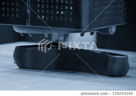 Advanced 3D printing machine operating in a high-tech facility for rapid prototyping and industrial manufacturing. 139243240