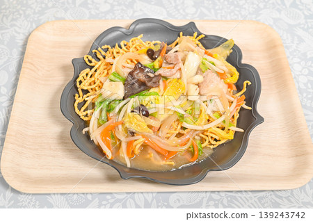Thick noodles in a thick sauce, served as sara udon. Thick noodles in a thick sauce, served as sara udon. 139243742