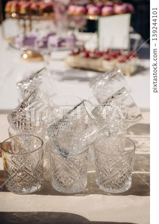 Empty glasses lying down on the table, ready to use, conception of party, event Empty glasses lying down on the table, ready to use, conception of party, event 139244101