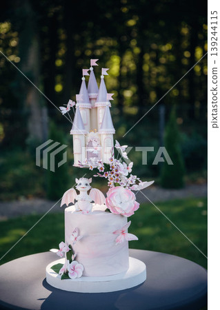 Beautiful birthday cake with dragon and castle, delicious meal, natural lighting Beautiful birthday cake with dragon and castle, delicious meal, natural lighting 139244115