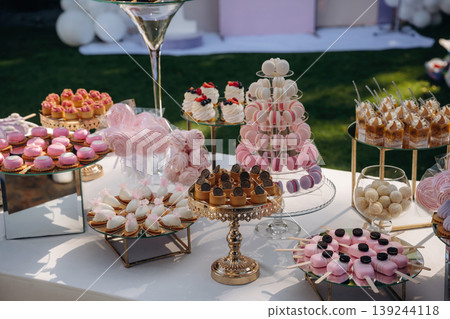 Served for the event. Party table with lot of sweets, desserts. Conception of celebration 139244118