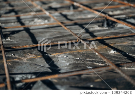 Detailed close up view of unfinished floor with concrete and metal rods Detailed close up view of unfinished floor with concrete and metal rods 139244268