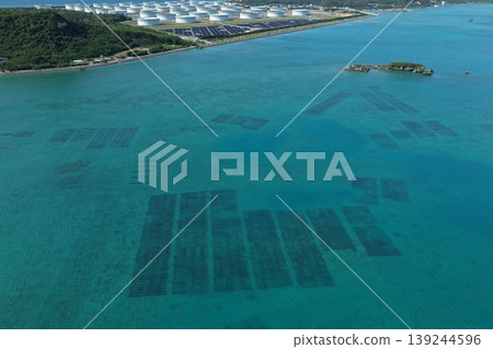 Drone aerial photography of mozuku seaweed farms and the blue ocean around Henza Island and Hamahiga Island in Okinawa Prefecture. Drone aerial photography of mozuku seaweed farms and the blue ocean around Henza Island and Hamahiga Island in Okinawa Prefecture. 139244596
