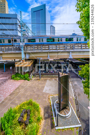 A view of the Yokohama cityscape in Japan, including the "Railway Founding Site Monument" located in front of the new south exit (city hall exit) of Sakuragicho Station. A view of the Yokohama cityscape in Japan, including the "Railway Founding Site Monument" located in front of the new south exit (city hall exit) of Sakuragicho Station. 139244626