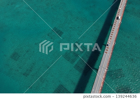 Drone aerial photography capturing a bridge spanning the blue sea in Okinawa Prefecture from a bird's-eye view. Drone aerial photography capturing a bridge spanning the blue sea in Okinawa Prefecture from a bird's-eye view. 139244636