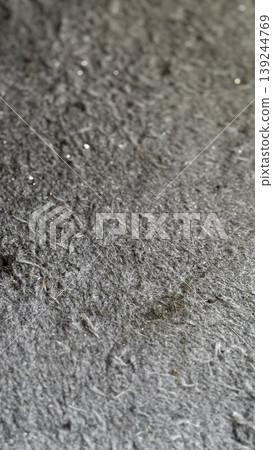 Close-Up of Textured Gray Fabric Surface with Fine Particles 139244769