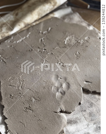 Textured Clay Surface with Imprints for Creative Projects 139244812