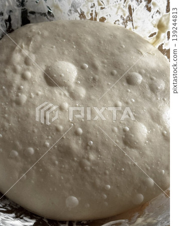 Freshly Fermented Dough Rising in a Bowl 139244813