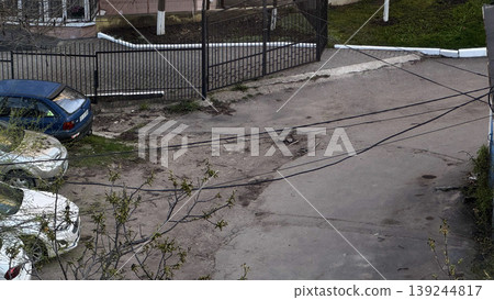 Urban Street Scene with Parked Cars and Fencing Urban Street Scene with Parked Cars and Fencing 139244817
