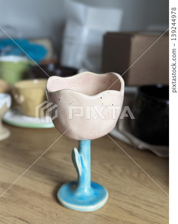 Charming Pink Ceramic Flower Pot on Wooden Surface Charming Pink Ceramic Flower Pot on Wooden Surface 139244978
