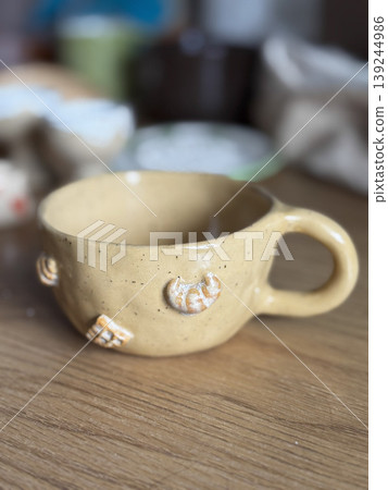 Unique Handmade Ceramic Cup with Decorative Elements Unique Handmade Ceramic Cup with Decorative Elements 139244986