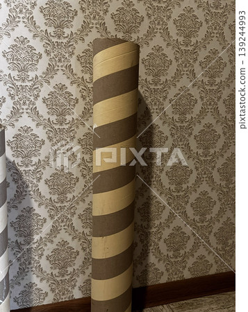 Decorative Paper Roll Display Against Elegant Wallpaper Background 139244993