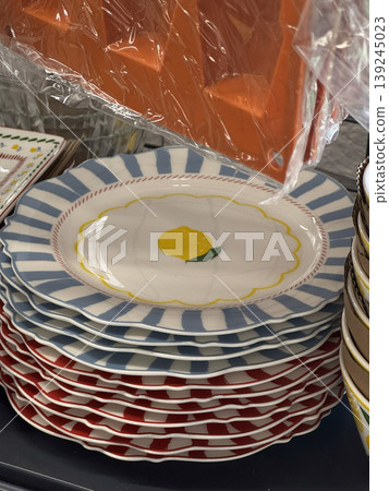 Colorful Decorative Plates Stacked for Display Colorful Decorative Plates Stacked for Display 139245023