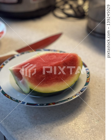 Fresh Watermelon Slice on a Colorful Plate Fresh Watermelon Slice on a Colorful Plate 139245029