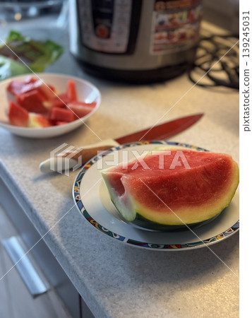 Fresh Watermelon Slices on Kitchen Counter Fresh Watermelon Slices on Kitchen Counter 139245031