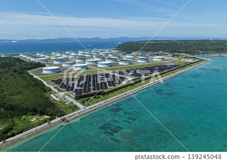 Drone aerial photography of the oil storage base and mega solar power facility on Henza Island, Okinawa Prefecture. Drone aerial photography of the oil storage base and mega solar power facility on Henza Island, Okinawa Prefecture. 139245048