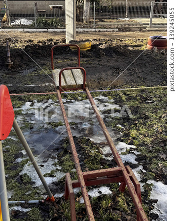 Abandoned Playground Equipment in Winter Landscape Abandoned Playground Equipment in Winter Landscape 139245055