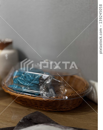 Elegant Display of Wrapped Treats in a Woven Basket Elegant Display of Wrapped Treats in a Woven Basket 139245058