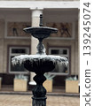 Elegant Ice-Covered Fountain in Urban Courtyard 139245074