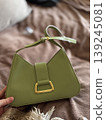 Stylish Green Handbag on Cozy Background 139245081
