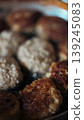 Delicious Homemade Meat Patties Sizzling in a Pan 139245083