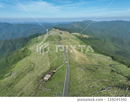 Drone aerial footage of the ridge roads and summer plateau scenery of the Shikoku Karst. Drone aerial footage of the ridge roads and summer plateau scenery of the Shikoku Karst. 139245392