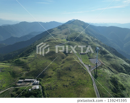 Drone aerial footage of the ridge roads and summer plateau scenery of the Shikoku Karst. Drone aerial footage of the ridge roads and summer plateau scenery of the Shikoku Karst. 139245395