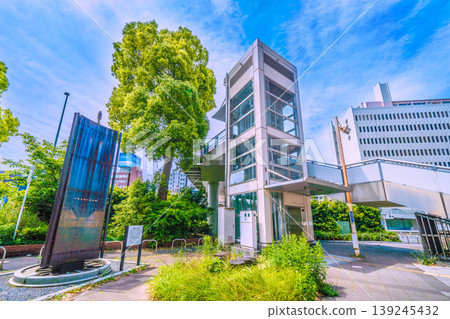 A view of the urban landscape of Yokohama, Japan, including the "Railway Founding Site Monument" and the "Original Landmark" located in front of the new south exit (city hall exit) of Sakuragicho Station. A view of the urban landscape of Yokohama, Japan, including the "Railway Founding Site Monument" and the "Original Landmark" located in front of the new south exit (city hall exit) of Sakuragicho Station. 139245432