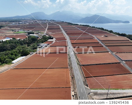 Drone aerial photography of potato fields and coastal farmland in Chijiwa, Nagasaki Prefecture. Drone aerial photography of potato fields and coastal farmland in Chijiwa, Nagasaki Prefecture. 139245436