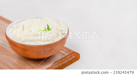 Cream cheese in bowl minimal food composition with copy space for branding design 139245479