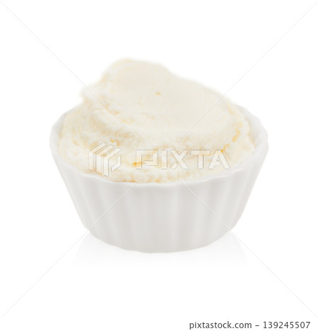 Cream cheese in white bowl isolated on white background Cream cheese in white bowl isolated on white background 139245507
