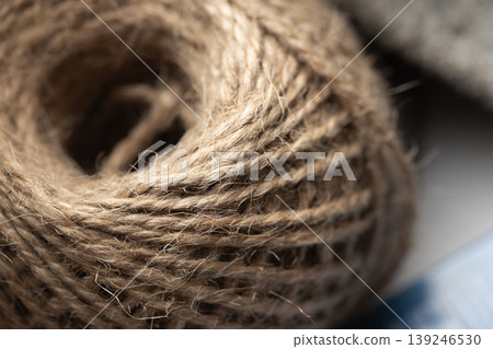 Close-up macro of a natural jute twine spool Close-up macro of a natural jute twine spool 139246530
