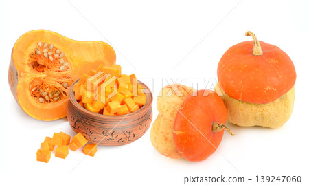Assorted Fresh Whole and Diced Pumpkins in Ceramic Bowl 139247060