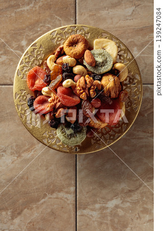 Assortment of dried tropical fruits, nuts and raisins. 139247084