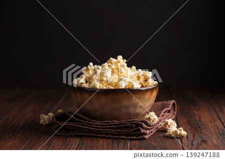 Popcorn Bowl on Dark Wooden Table Popcorn Bowl on Dark Wooden Table 139247188