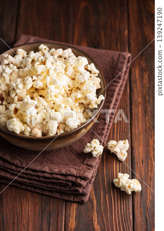 Popcorn Bowl on Dark Wooden Table Popcorn Bowl on Dark Wooden Table 139247190