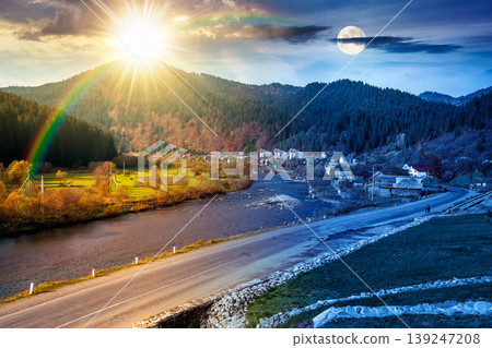 mountain landscape during fall season. day meet night. sun and moon over rural scenery with river at twilight. composite image of a countryside road through valley near village for travel background mountain landscape during fall season. day meet night. sun and moon over rural scenery with river at twilight. composite image of a countryside road through valley near village for travel background 139247208
