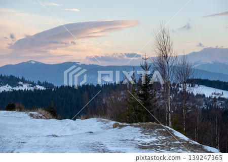 Winter evening sunset mountains (Ukraine, Carpathians - mountain peaks scenery view from Yablunytsia Pass). Winter evening sunset mountains (Ukraine, Carpathians - mountain peaks scenery view from Yablunytsia Pass). 139247365
