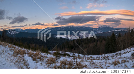 Winter evening sunset mountains (Ukraine, Carpathians - mountain peaks Dovbushanka, Khomyak and Synyak scenery view from Yablunytsia Pass). Winter evening sunset mountains (Ukraine, Carpathians - mountain peaks Dovbushanka, Khomyak and Synyak scenery view from Yablunytsia Pass). 139247374