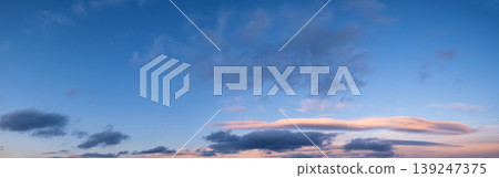Colorful evening sky with clouds panorama background Colorful evening sky with clouds panorama background 139247375