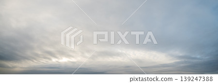 Clouds in the overcast evening sky view. Clouds in the overcast evening sky view. 139247388