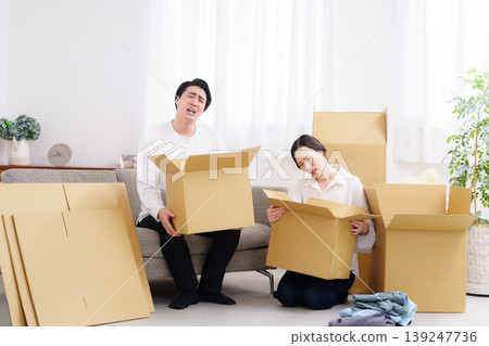 A young couple preparing to move A young couple preparing to move 139247736